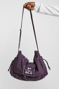 Bandolera Thinking Splattered con pintura morada