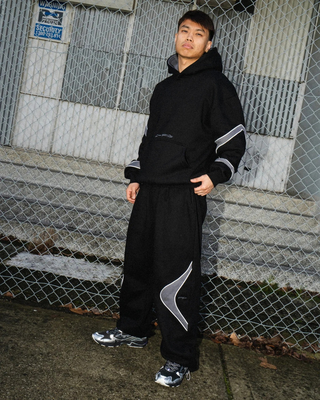 Pantalones deportivos cinéticos Negro / Gris metalizado